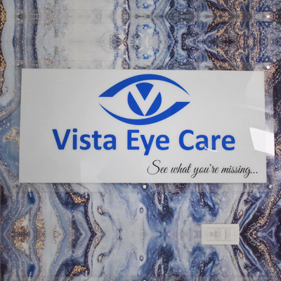 Vista Eye Care logo signage on marble-pattern reception wall