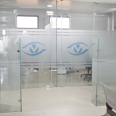 Frosted-glass partition doors etched with the Vista Eye Care logo