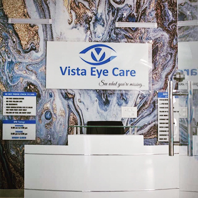 Reception counter close-up with pricing and timing signage