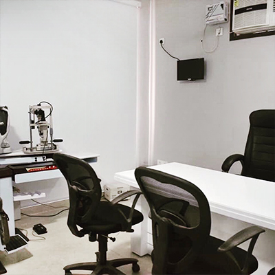 Consultation room with ophthalmic exam equipment