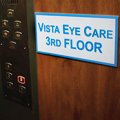 Elevator panel with Vista Eye Care 3rd Floor signage